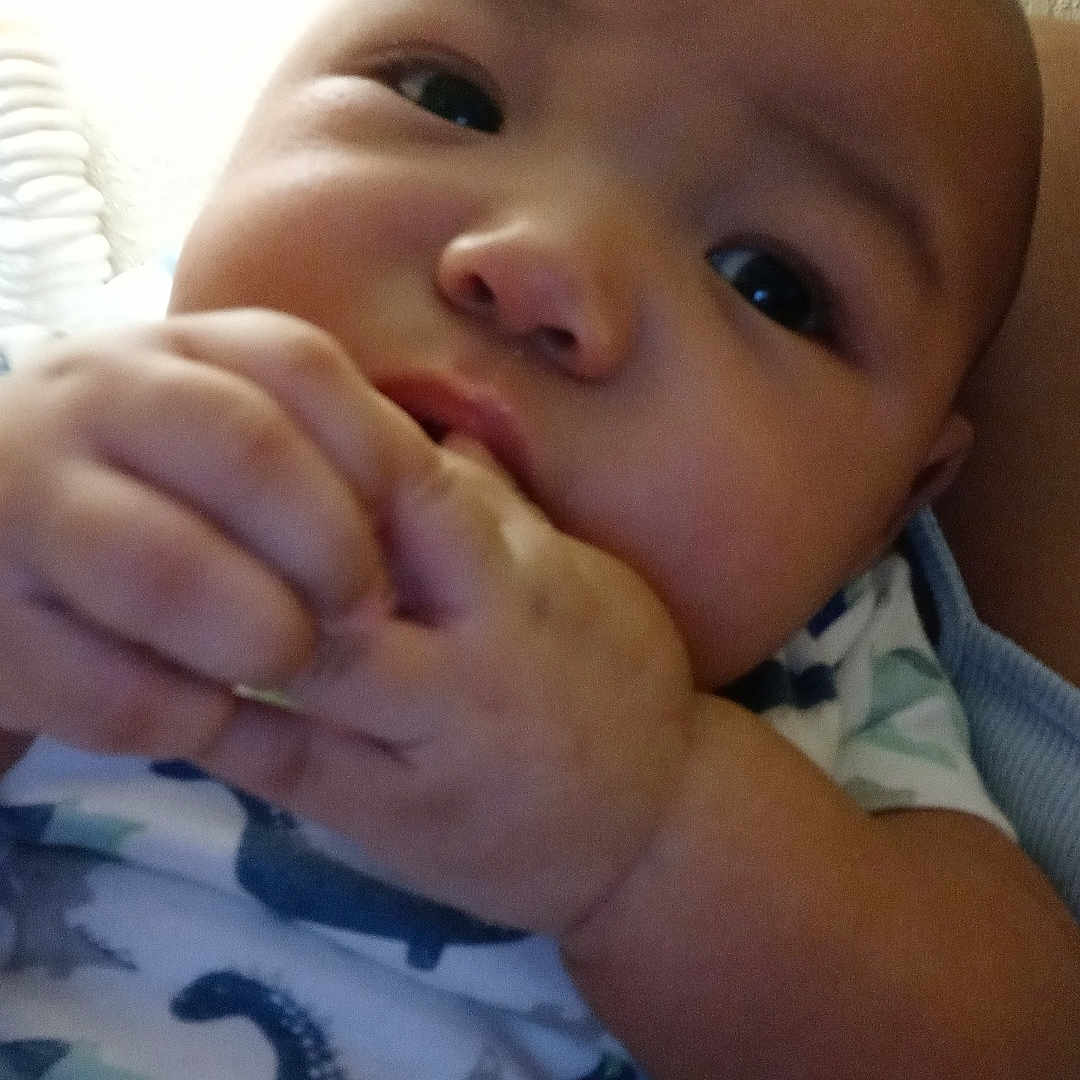 Royce joined the competition — help win amazing prizes! arm, baby, bed, bodypart, couch, cutlery, face, finger, fist, furniture, hand, head, mouth, newborn, person, photography, portrait, quilt, spoon, wrist