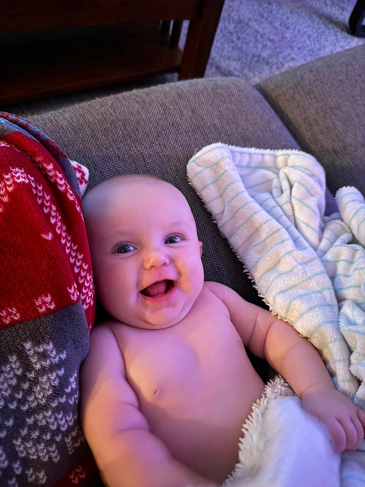 Kennedy joined the competition — help win amazing prizes! architecture, baby, babylaughing, blanket, building, couch, cushion, face, furniture, happy, head, homedecor, laughing, newborn, person, photography, portrait, quilt, smile, towel