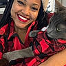 Blue joined the competition — help win amazing prizes! woman, cat, smiling, holiday, santa_hat, red_lipstick, braided_hair, indoor, plaid_shirt, matching_outfits, gray_cat, pet, festive, portrait, closeup, happy, cozy, christmas, cute, holding