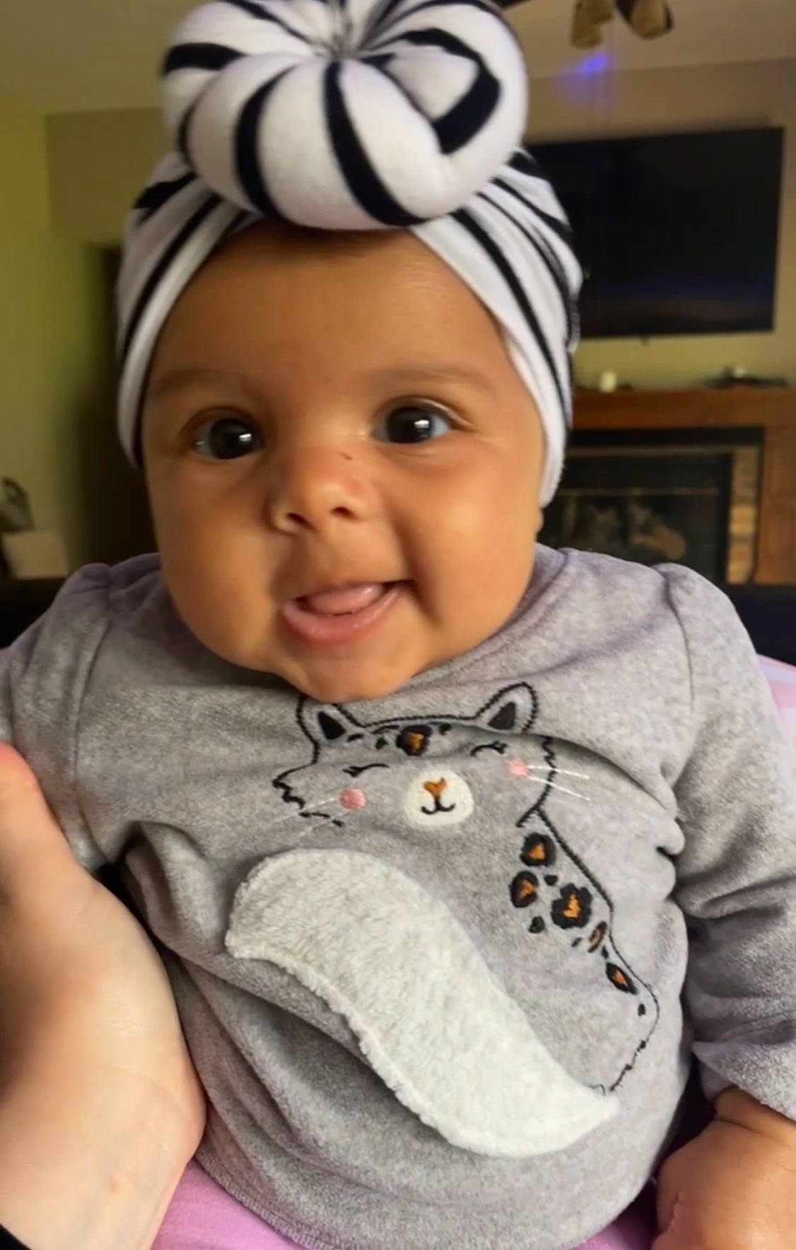 Laurel joined the competition — help win amazing prizes! baby_toddler_clothing, cap, cheek, chin, eye, eyebrow, face, forehead, gesture, happy, head, headwear, helmet, iris, lip, mouth, nose, person, skin, sleeve