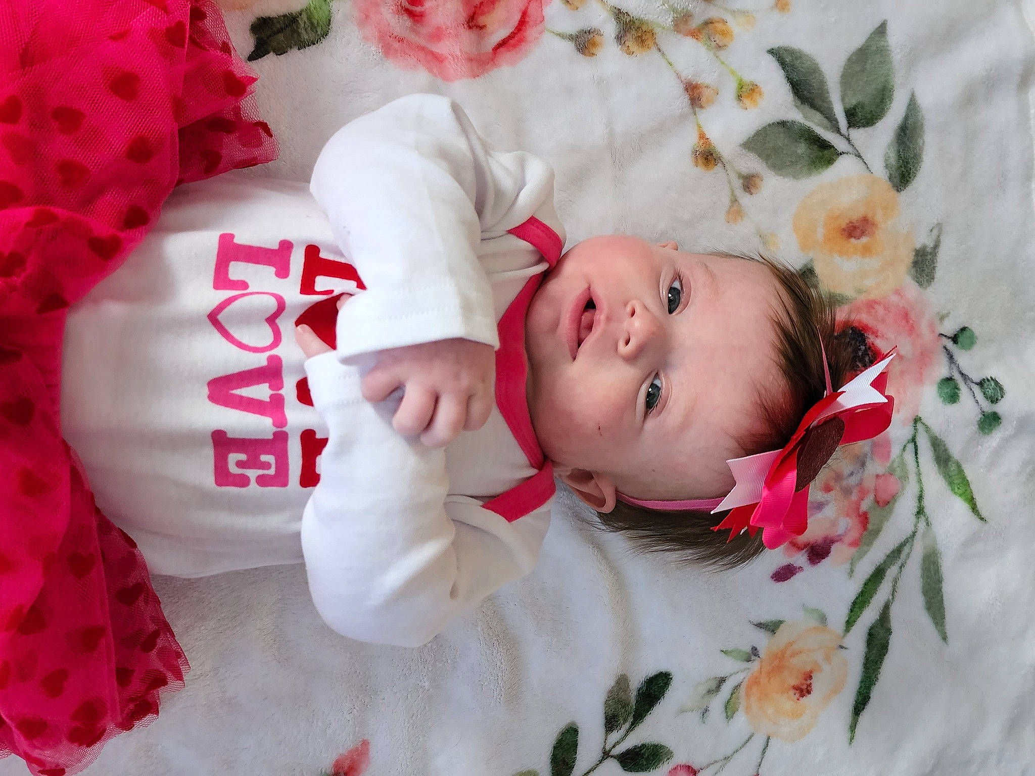 Jaelynn is registered to the contest to win money with this photo: baby, baby_toddler_clothing, beauty, cheek, child, face, facial_expression, flower, happy, head, lip, people, person, petal, pink, product, skin, sleeve, textile, toddler