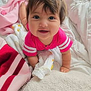 Ily Noriega is registered to the contest to win money with this photo: baby, bed, blanket, child, clothing, comfort, crawling, cute, eyes, face, hair, happy, indoors, infant, pink_shirt, portrait, skin, smile, soft, toddler
