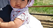 Ily Noriega joined the competition — help win amazing prizes! baby, child, face, hat, hello_kitty, outdoor, greenery, sunny_day, cute, smile, person, clothing, infant, nature, portrait, white_blanket, holding, headwear, toddler, daylight