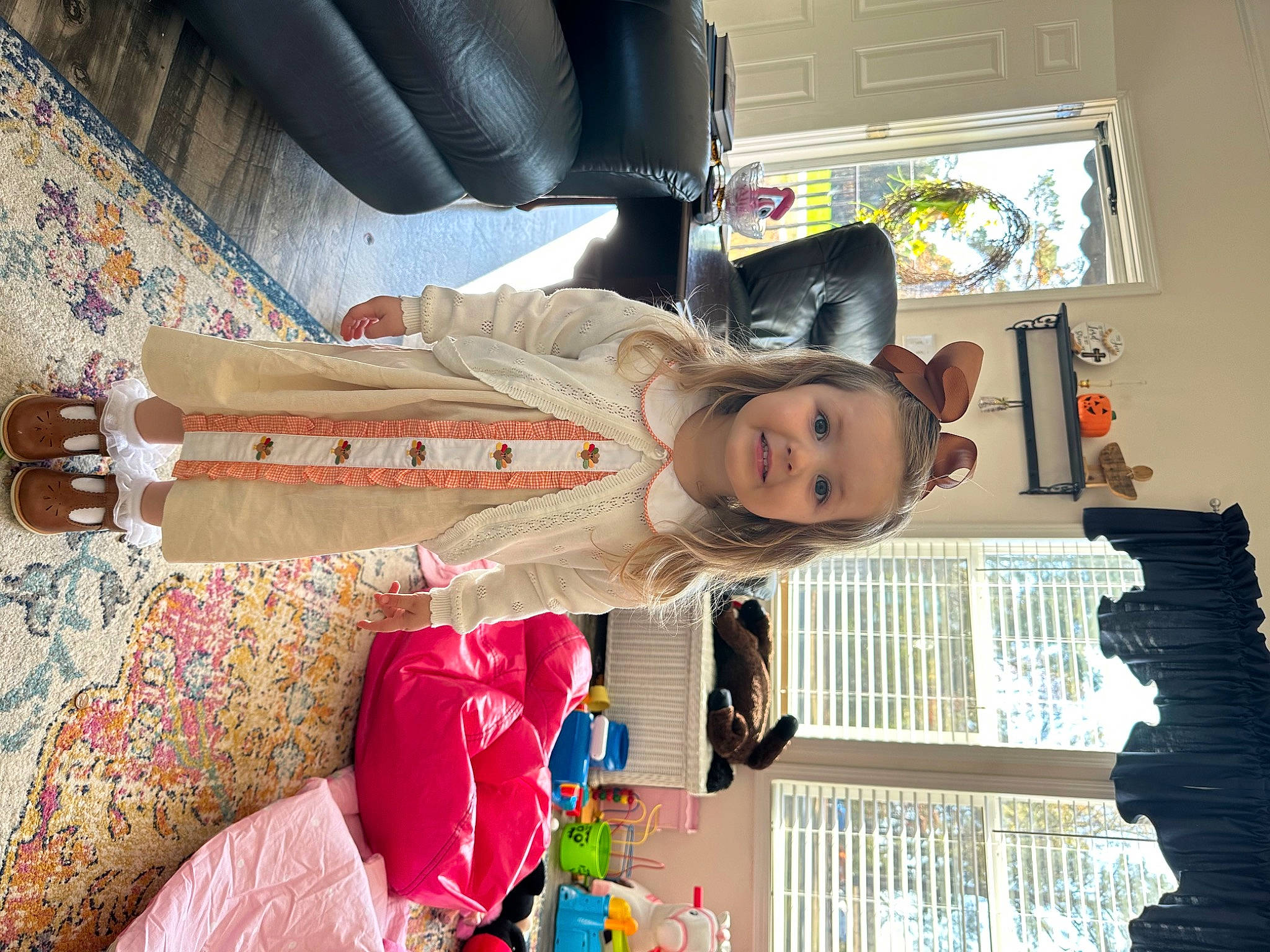 Anna is registered to the contest to win money with this photo: child, family_car, flooring, fun, joy, person, room, textile, toddler, tree, vacation, window