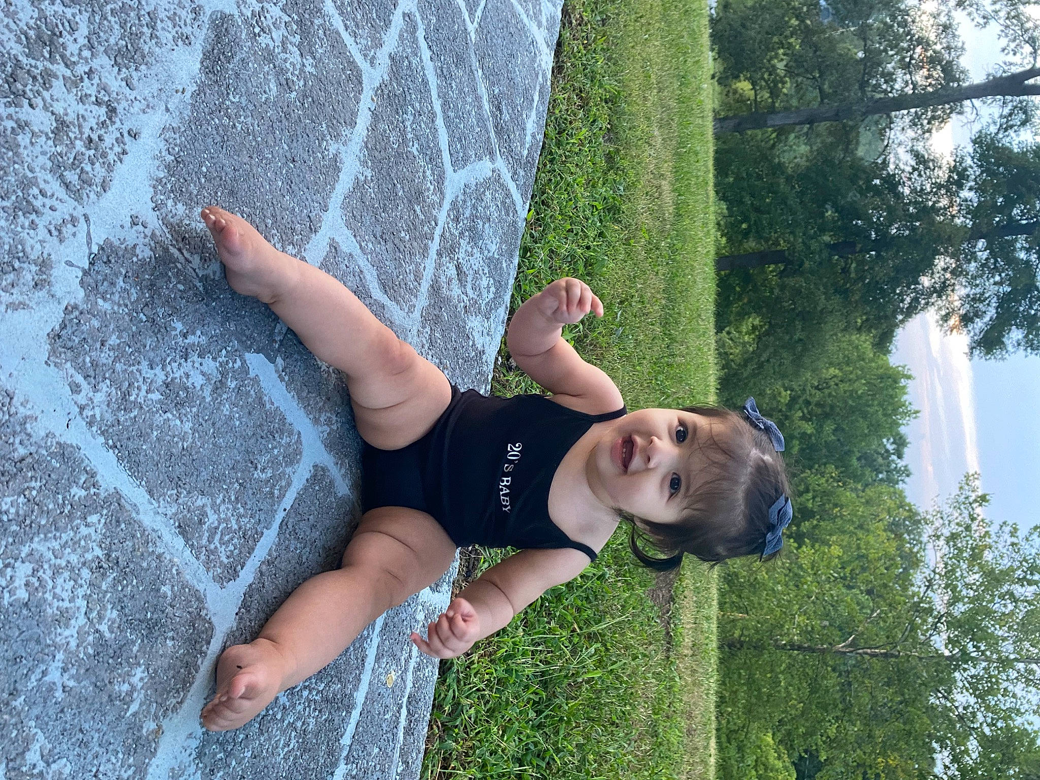 Samara is registered to the contest to win money with this photo: beauty, concrete, elbow, fun, grass, grass_family, happy, human_leg, leisure, people_in_nature, person, plant, recreation, shorts, sky, summer, sunglasses, thigh, tree, vacation