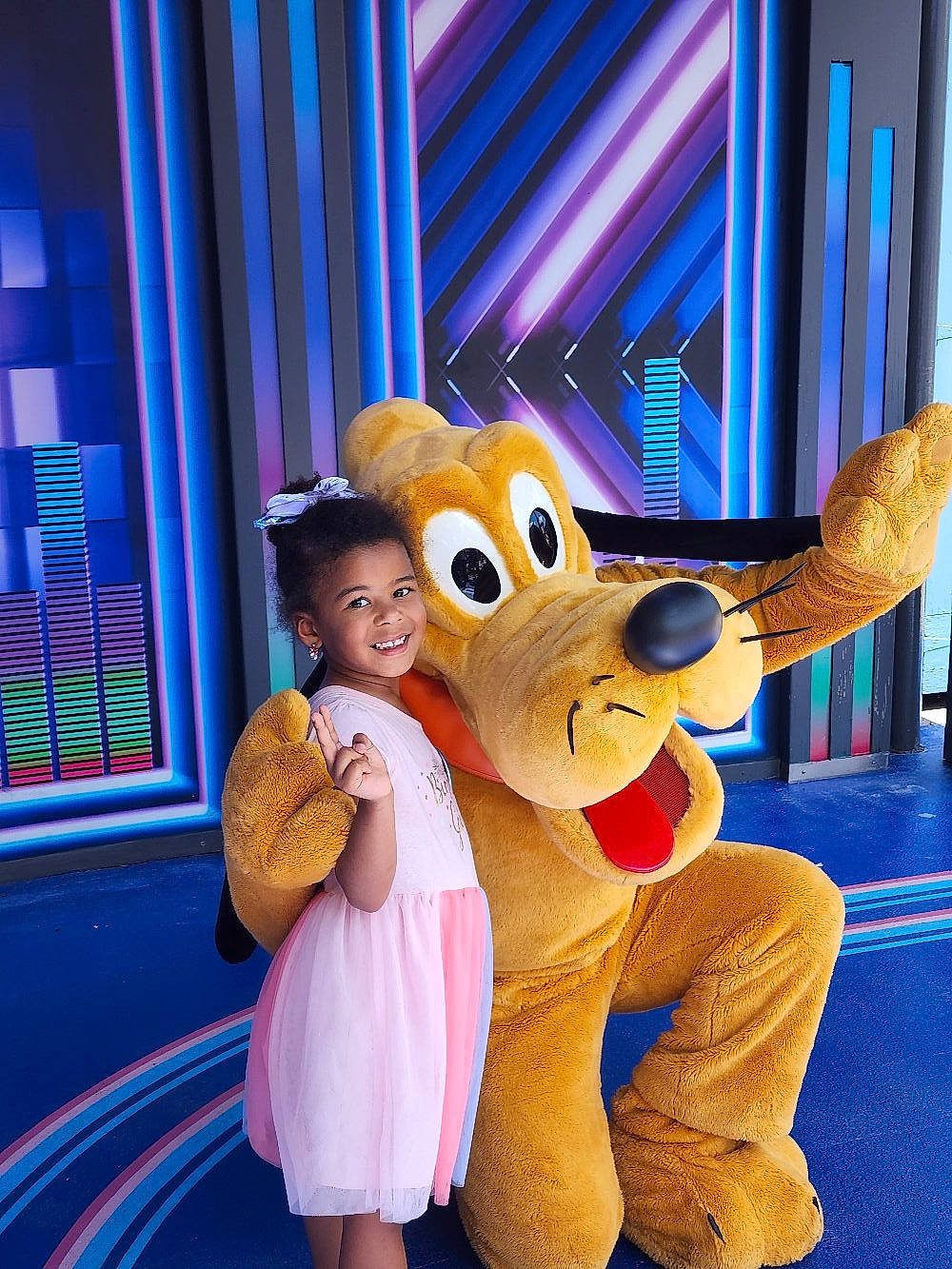 Olivia joined the competition — help win amazing prizes! blue, curtain, entertainment, event, fawn, flooring, fun, gesture, happy, hat, joy, leisure, magenta, mammal, mascot, person, pink, purple, recreation, smile