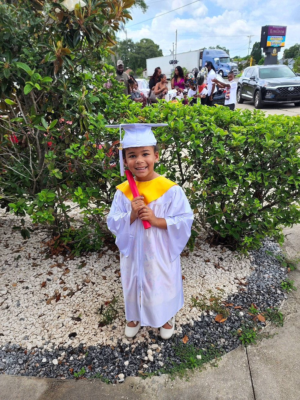 Olivia joined the competition — help win amazing prizes! asphalt, car, city, cloud, event, grass, headgear, headwear, joy, landscape, leisure, monk, motor_vehicle, person, plant, road, road_surface, shrub, sky, tourism