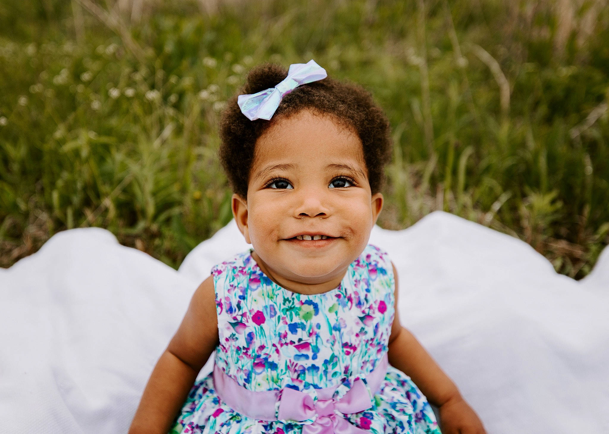 Desiree is registered to the contest to win money with this photo: baby, baby_toddler_clothing, day_dress, dress, event, flash_photography, fun, grass, hairstyle, happy, headband, headpiece, iris, joy, mammal, people_in_nature, person, plant, skin, smile