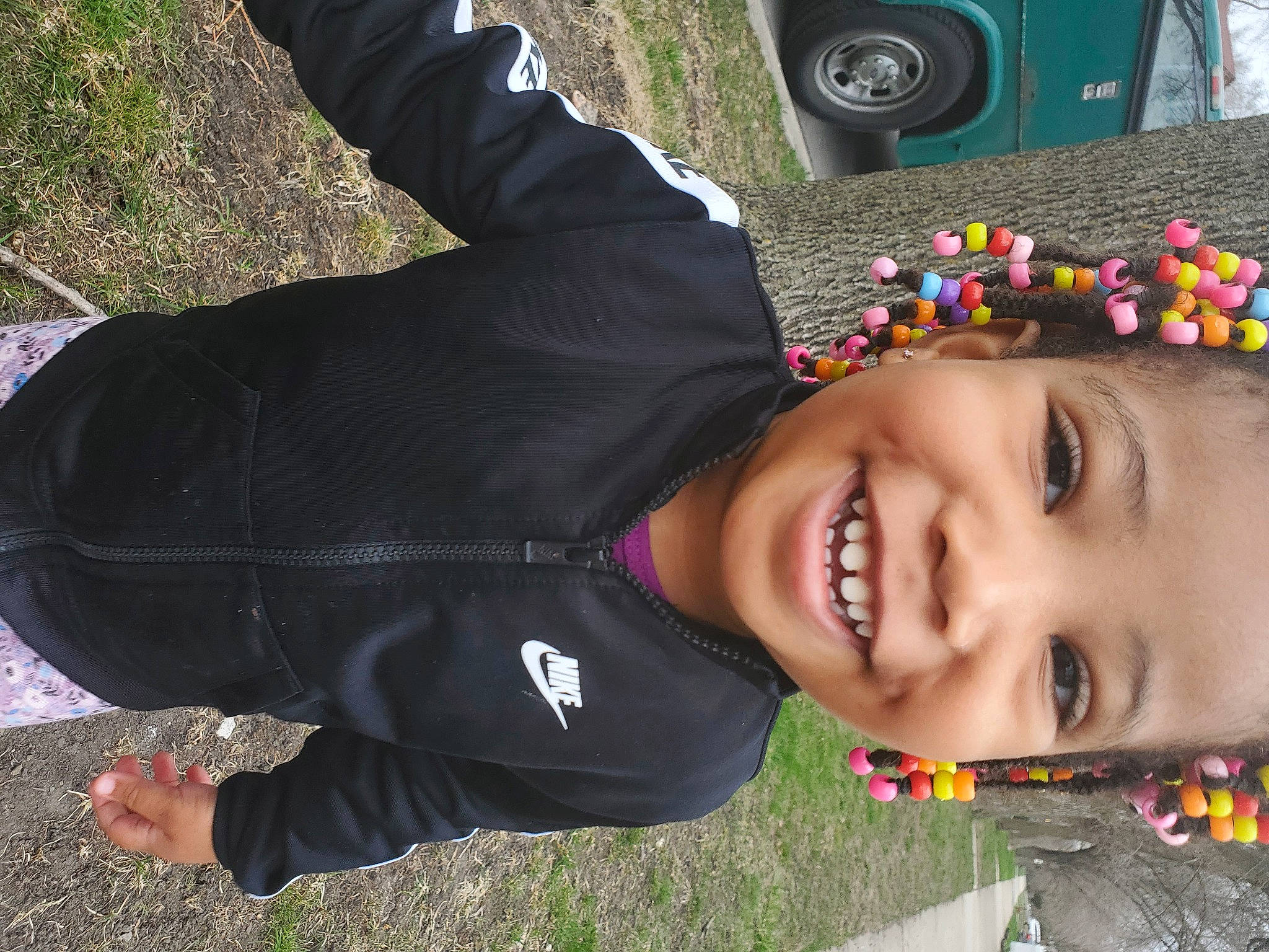 Desiree is registered to the contest to win money with this photo: automotive_tire, baby, black, child, fashion_accessory, fun, grass, green, happy, joy, laugh, leaf, leisure, luxury_vehicle, people_in_nature, person, personal_protective_equipment, plant, recreation, smile