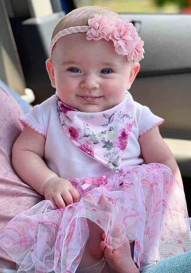 Ximena is registered to the contest to win money with this photo: baby, baby_toddler_clothing, cheek, child, day_dress, dress, embellishment, hairstyle, happy, headwear, iris, joy, lip, magenta, one_piece_garment, person, pink, product, purple, skin