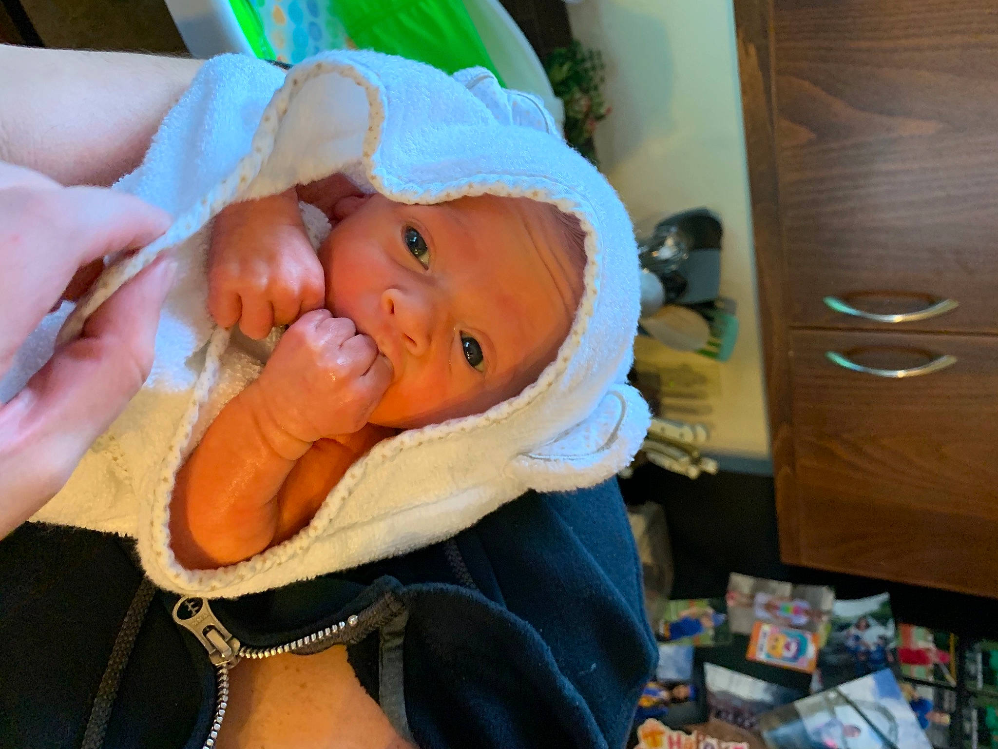 Ximena is registered to the contest to win money with this photo: baby, baby_products, baby_toddler_clothing, cabinetry, chest_of_drawers, child, comfort, drawer, event, finger, hat, headwear, hospital, mouth, nail, person, room, skin, smile, thumb