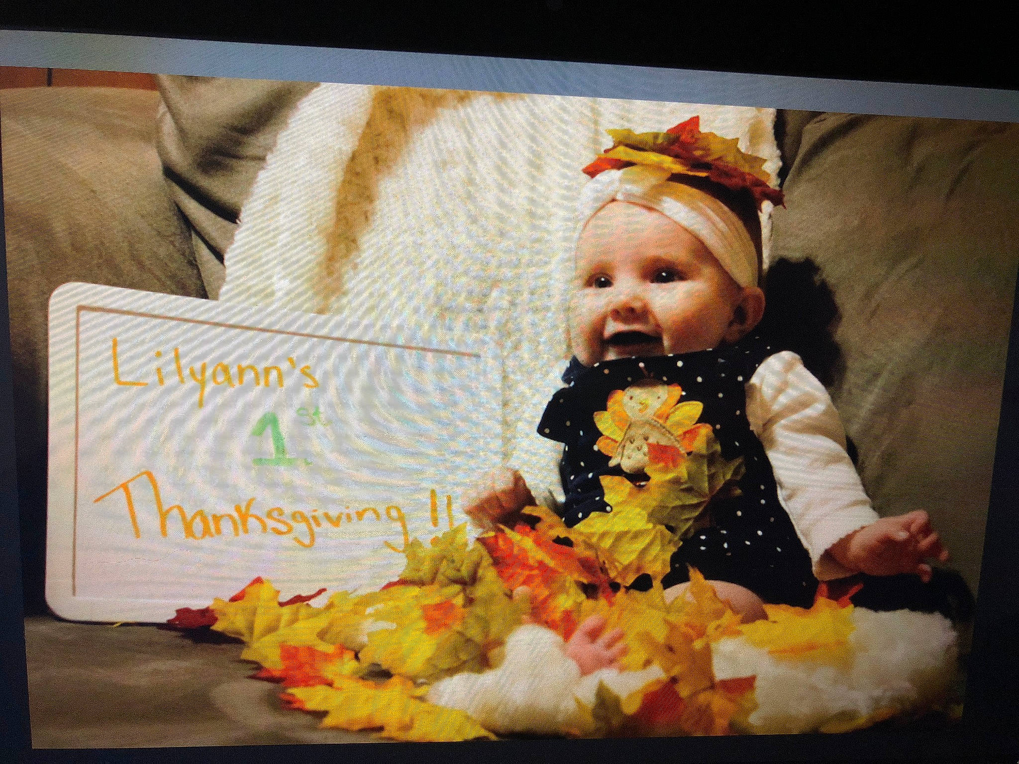 Lilyann joined the competition — help win amazing prizes! autumn, baby, cheek, child, food, hair_accessory, happy, leaf, person, photo_caption, photography, sitting, smile, toddler, yellow