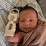 Hadyn is registered to the contest to win money with this photo: newborn, baby, infant, blanket, hospital, medical_brace, arm_support, resting, sleepy, face, skin, person, bed, linen, healthcare, cute, child, swaddled, soft, indoors
