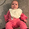 baby, child, pink_clothing, bib, carpet, floor, indoor, person, cute, infant, looking_at_camera, casual, texture, home, toddler, sitting, face, hands, feet, cables