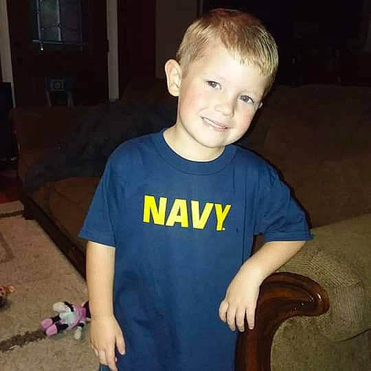 Aiden is registered to the contest to win money with this photo: arm, blond, child, cool, ear, face, family, fun, head, joy, people, person, play, shoulder, sleeve, smile, t_shirt, toddler, tooth, vacation