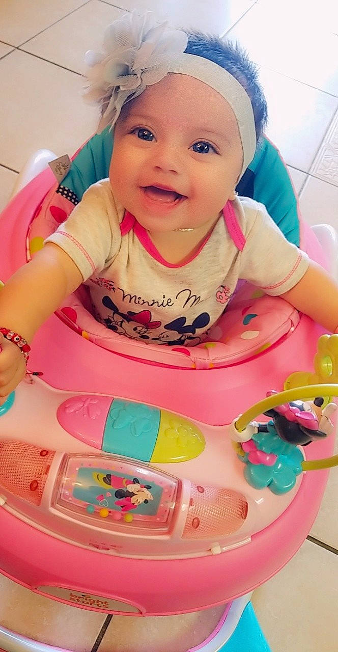 Oriana is registered to the contest to win money with this photo: baby_products, cheek, child, finger, fun, girl, infant, person, pink, play, product, skin, smile, sweetness, toddler, toy