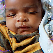 Matrix joined the competition — help win amazing prizes! baby, infant, face, sleepy, blanket, curly_hair, heart_filter, phone_screenshot, mobile_app, user_interface, child, portrait, closeup, cozy, wrapped, expression, digital, screen, technology, cute