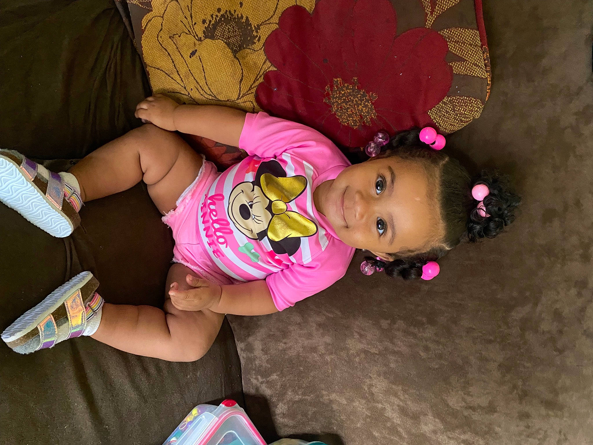 Reign is registered to the contest to win money with this photo: baby, baby_products, baby_toddler_clothing, child, comfort, foot, fun, happy, human_body, human_leg, joy, knee, lap, magenta, pattern, person, pink, sandal, shorts, sitting