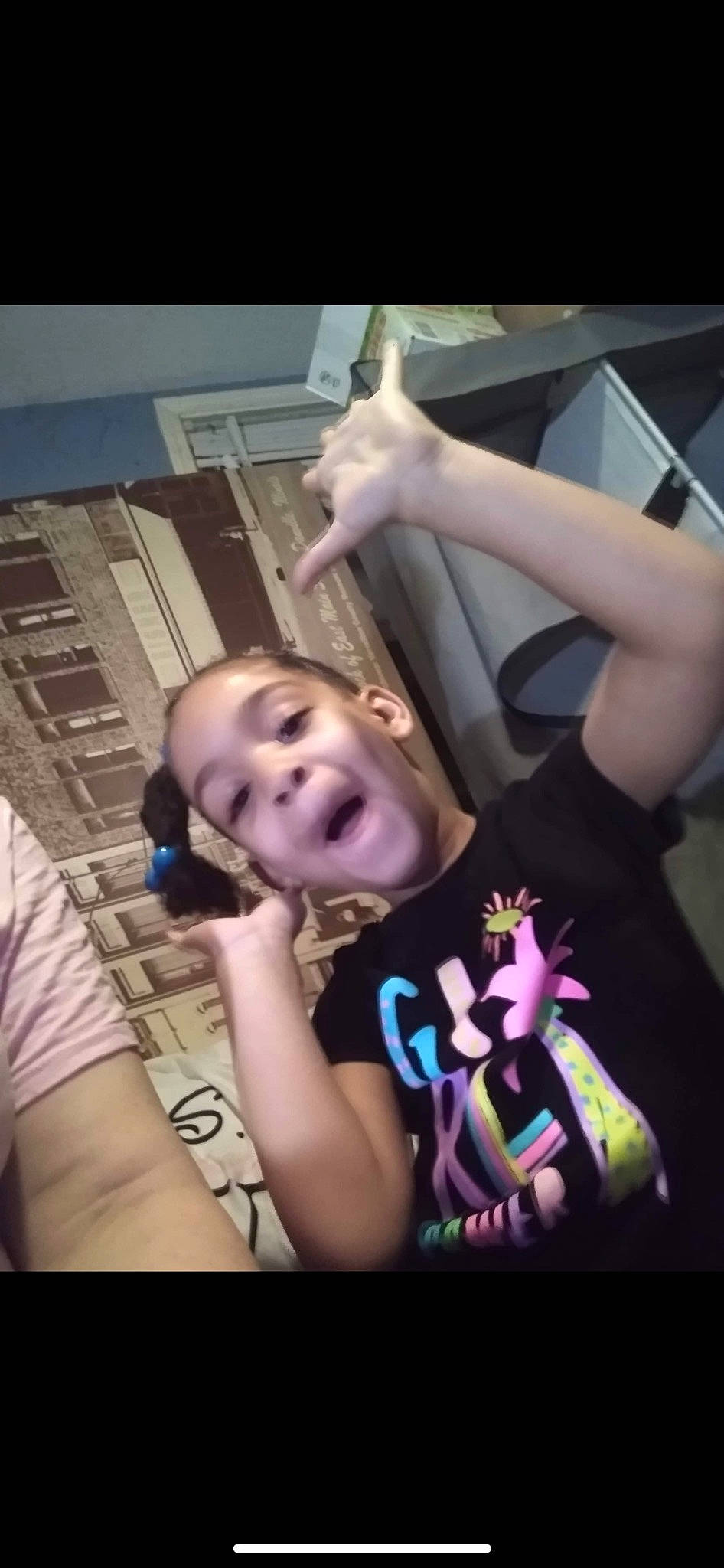 Naomi is registered to the contest to win money with this photo: arm, chest, child, cool, ear, elbow, eyebrow, finger, flash_photography, fun, gesture, hand, happy, mouth, person, purple, shoulder, smile, t_shirt, thumb