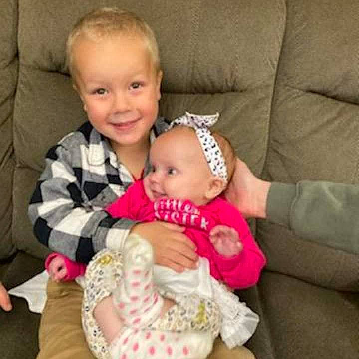 Mason joined the competition — help win amazing prizes! arm, baby, baby_toddler_clothing, cheek, comfort, couch, dress, eye, face, finger, hair, happy, head, human_body, iris, joy, lap, person, skin, sleeve