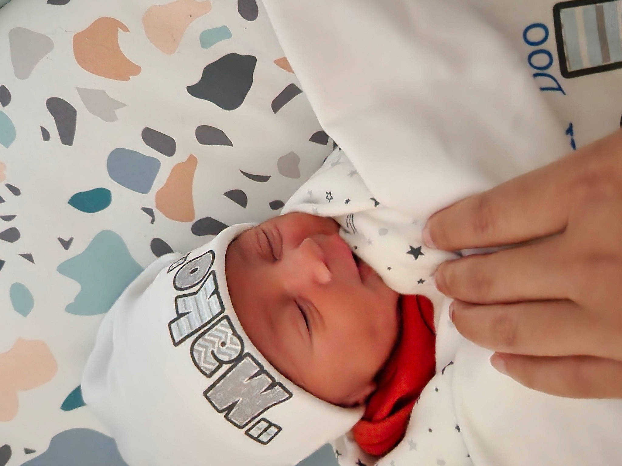 Makoa is registered to the contest to win money with this photo: baby, baby_products, baby_sleeping, baby_toddler_clothing, child, comfort, eyelash, finger, gesture, happy, hat, headwear, linens, nail, pattern, person, sleeve, textile, thumb, toddler