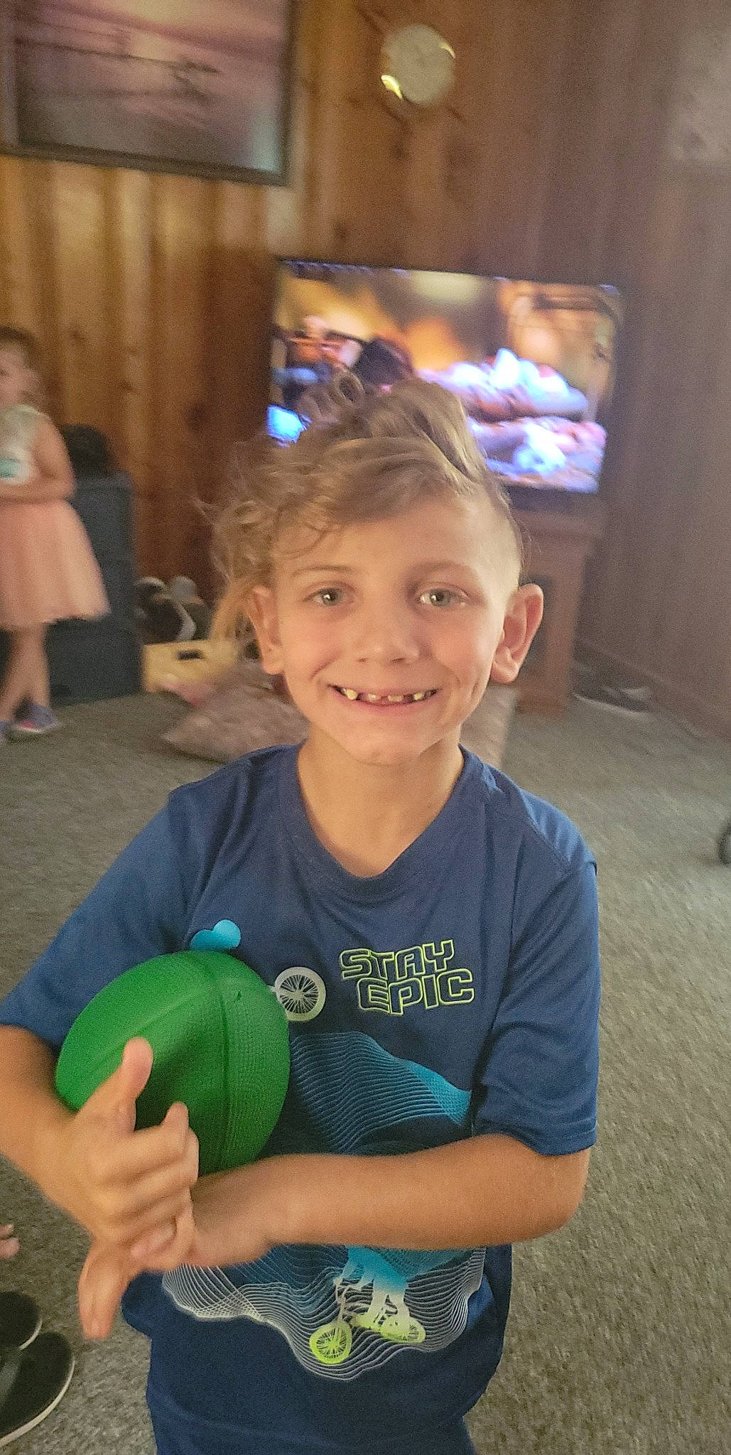 Carson joined the competition — help win amazing prizes! ball, chair, child, event, flooring, fun, games, grass, happy, joy, leisure, mammal, person, recreation, room, sitting, smile, standing, t_shirt, television