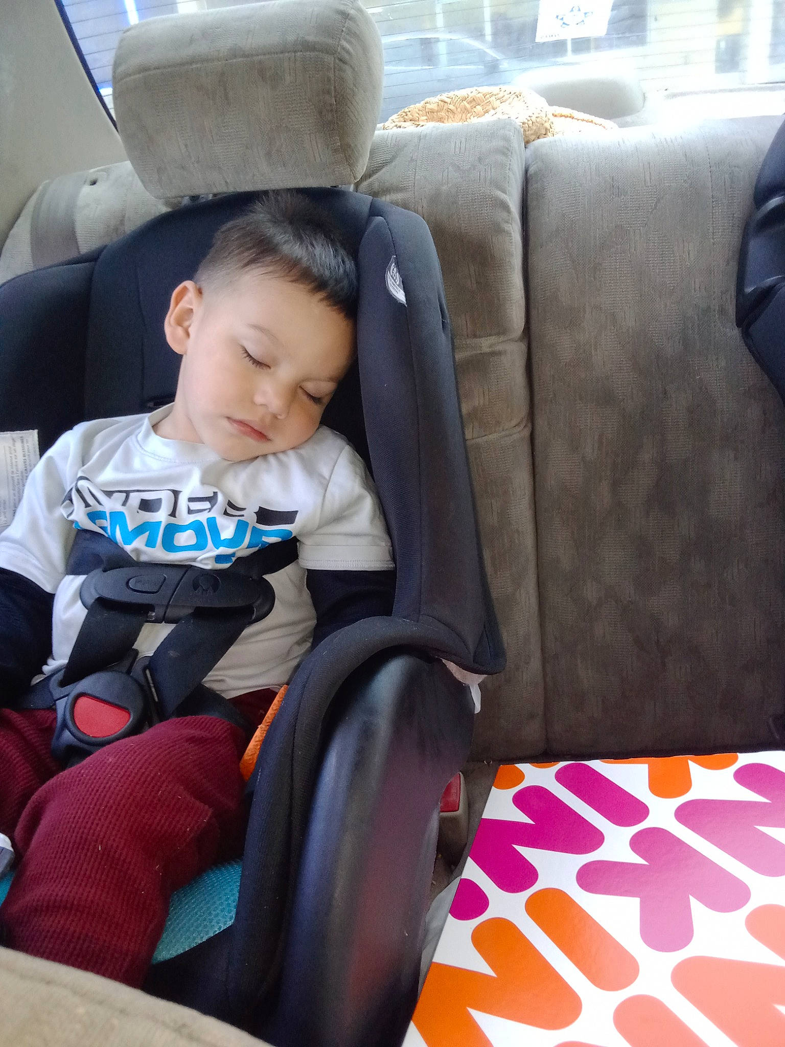 James is registered to the contest to win money with this photo: armrest, auto_part, baby, baby_products, car_seat, car_seat_cover, child, comfort, family_car, head_restraint, leisure, luxury_vehicle, motor_vehicle, passenger, person, product, sitting, steering_wheel, toddler, travel
