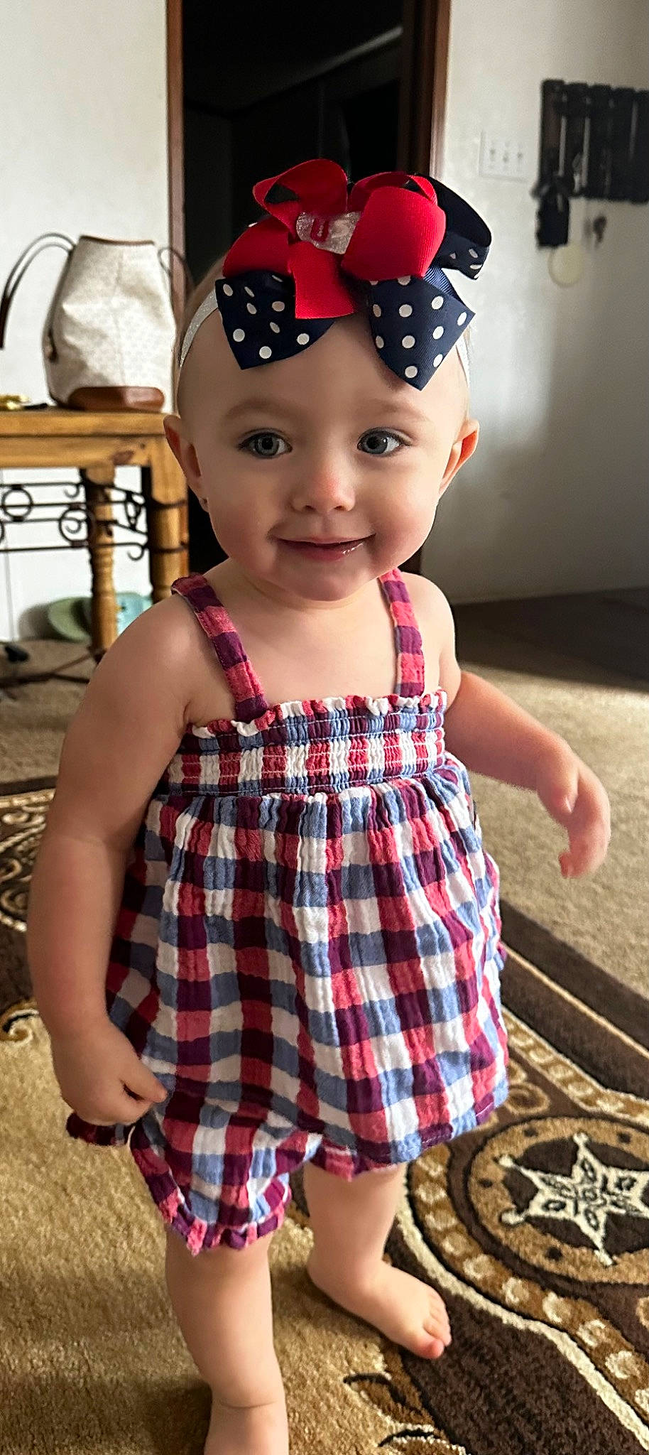 Ryleigh joined the competition — help win amazing prizes! baby_toddler_clothing, cap, child, clothing, dress, facial_expression, hairstyle, happy, head, headwear, joy, lip, person, photograph, pink, plaid, red, skin, sleeve, smile
