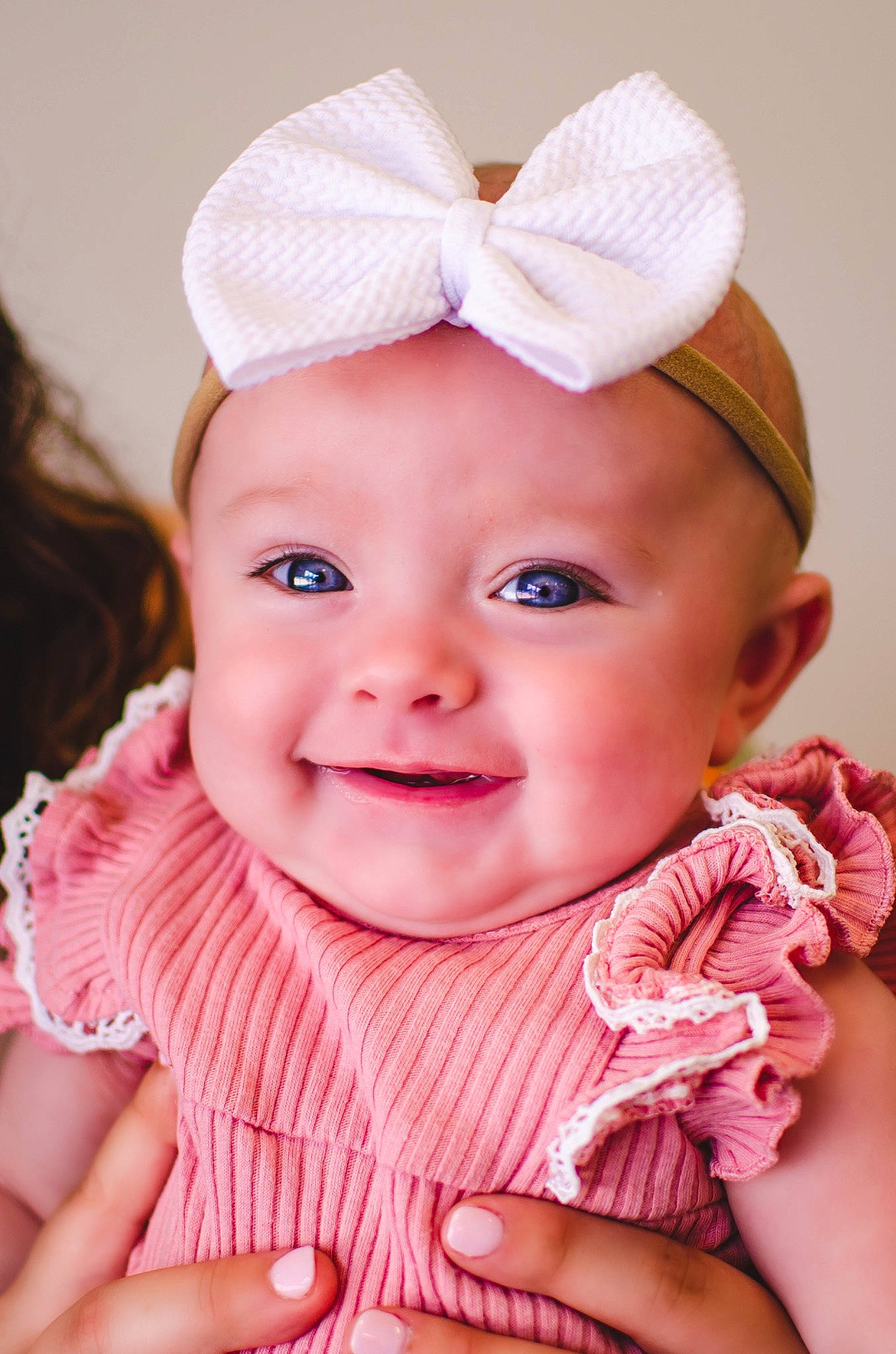 Ryleigh is registered to the contest to win money with this photo: baby, baby_toddler_clothing, cap, cheek, chin, eye, face, finger, gesture, hand, happy, head, headwear, iris, joy, lip, outerwear, person, pink, skin