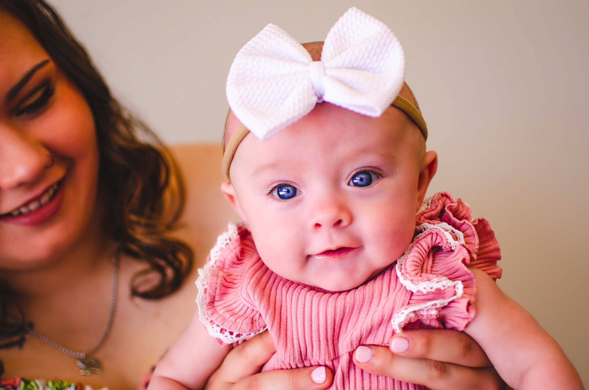 Ryleigh is registered to the contest to win money with this photo: baby, baby_toddler_clothing, cheek, child, dress, eye, face, finger, fun, gesture, hand, happy, head, headwear, human, iris, joy, lip, person, pink