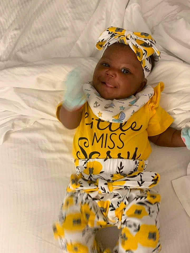 Kehlani joined the competition — help win amazing prizes! arm, baby, baby_products, baby_toddler_clothing, chair, child, comfort, face, fun, happy, headwear, laugh, linens, pattern, person, sitting, sleeve, smile, t_shirt, textile