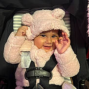 Julieth is registered to the contest to win money with this photo: baby, child, smile, pink, hoodie, fuzzy_clothing, car_seat, safety_harness, cute, portrait, happy, infant, indoors, face, hand, warm_clothing, seatbelt, baby_girl, cozy, playful
