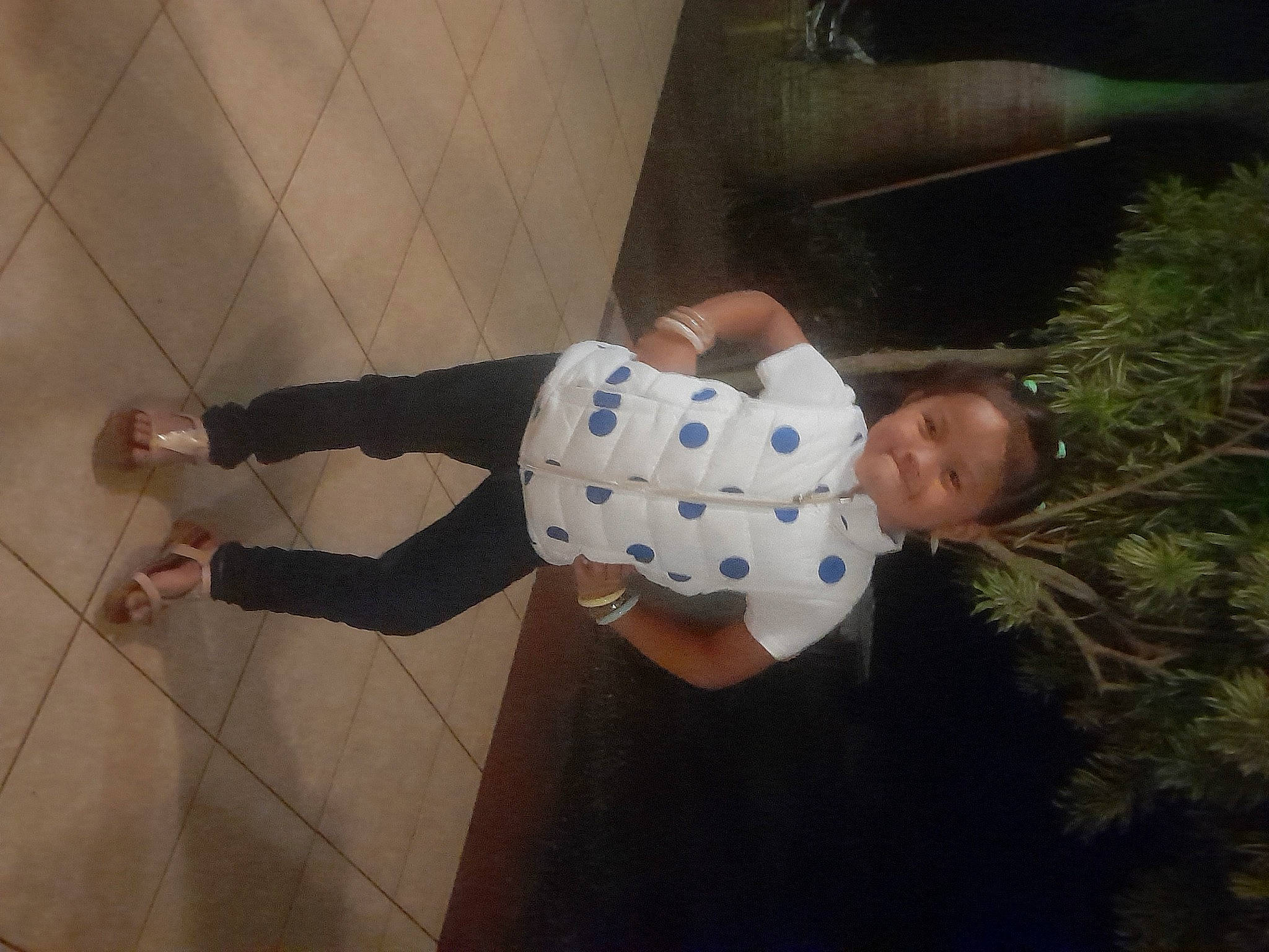 Vairani Et Vaihirani participe au concours pour gagner de l'argent avec cette photo : baby, baby_toddler_clothing, child, conifer, fir, floor, flooring, foot, fun, hardwood, human_leg, joy, knee, pattern, person, room, sandal, sitting, space, thigh