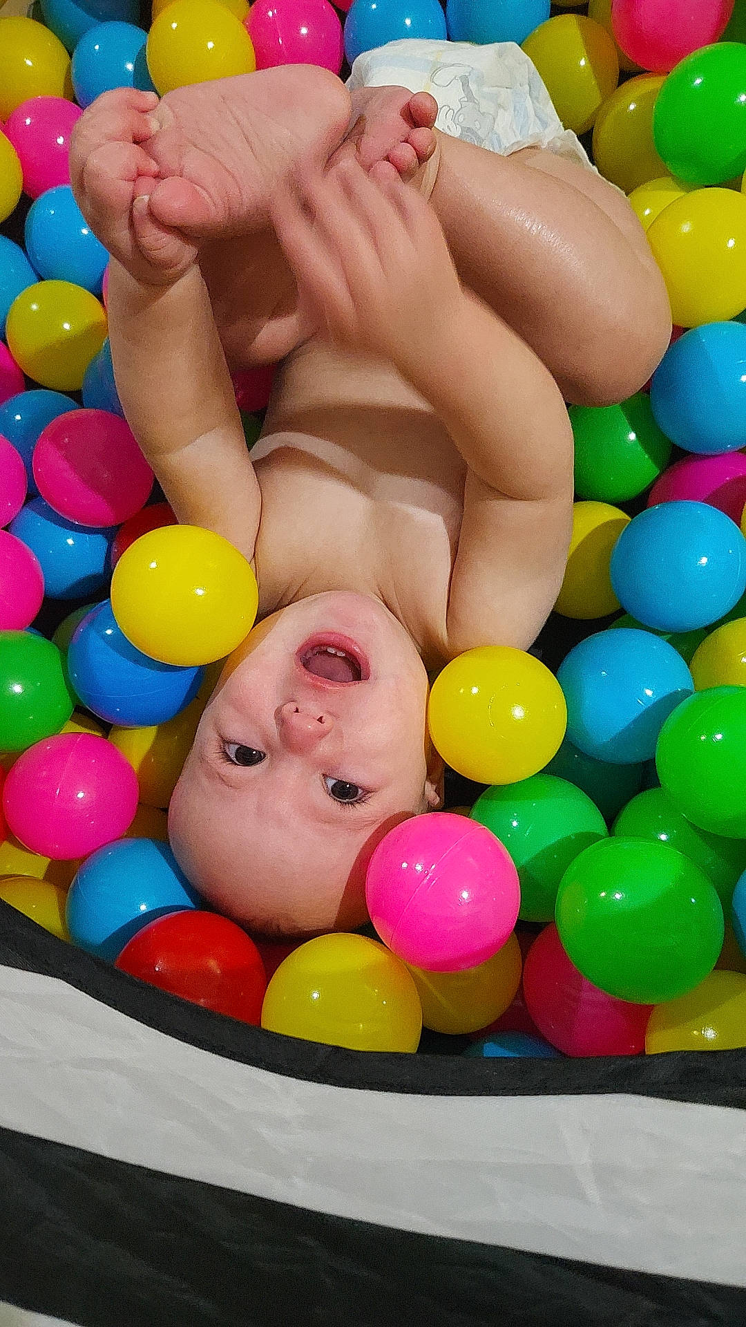 Lane is registered to the contest to win money with this photo: baby, baby_playing_with_toys, ball_pit, beauty, cheek, chest, child, event, facial_expression, fun, happy, head, leisure, organ, person, photograph, product, recreation, stomach, toddler