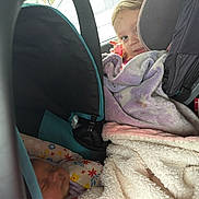 Raylynn joined the competition — help win amazing prizes! child, baby, car_seat, blanket, sleeping, curious, car_interior, seatbelt, toddler, infant, cozy, travel, window, fabric, headrest, safety, young_child, car_trip, resting, portrait