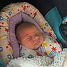 Raylynn is registered to the contest to win money with this photo: baby, sleeping, blanket, cushion, floral_pattern, infant, cozy, child, resting, soft, warm, indoor, portrait, head, peaceful, newborn, comfort, cute, wrapped, closeup