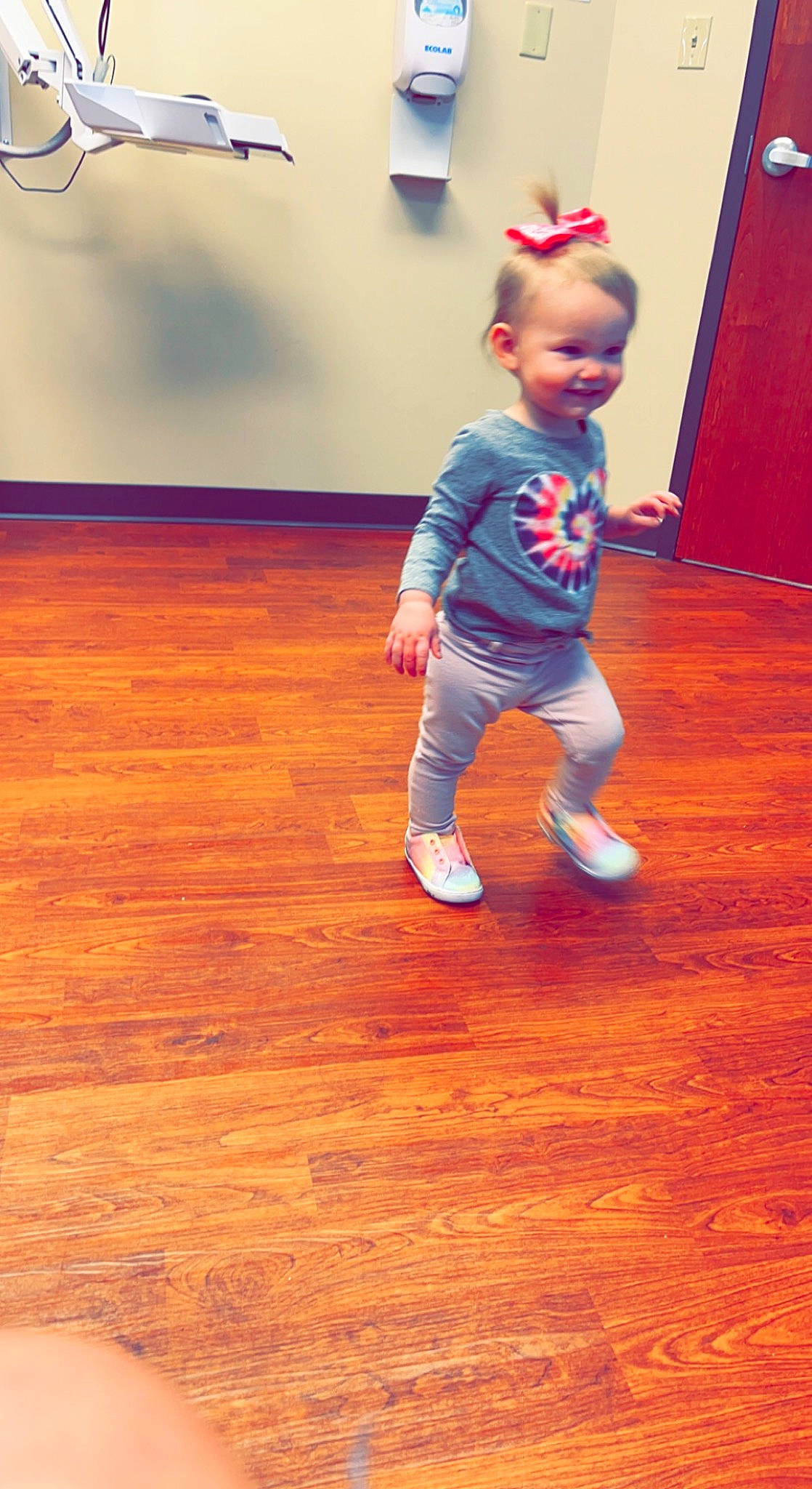Amyah is registered to the contest to win money with this photo: baby, baby_toddler_clothing, child, electric_blue, floor, flooring, fun, happy, hardwood, human_leg, laminate_flooring, person, room, sleeve, smile, t_shirt, toddler, varnish, wood, wood_flooring