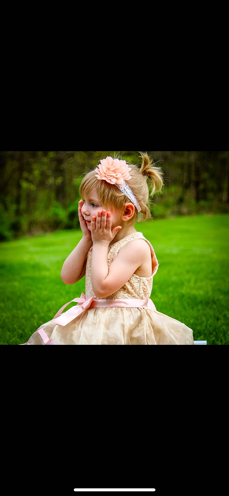 Peyton is registered to the contest to win money with this photo: bridal_accessory, bridal_clothing, bridal_party_dress, dress, eye, flash_photography, flower, gown, grass, happy, head, headpiece, meadow, people_in_nature, person, petal, plant, toddler, tree, wedding_ceremony_supply