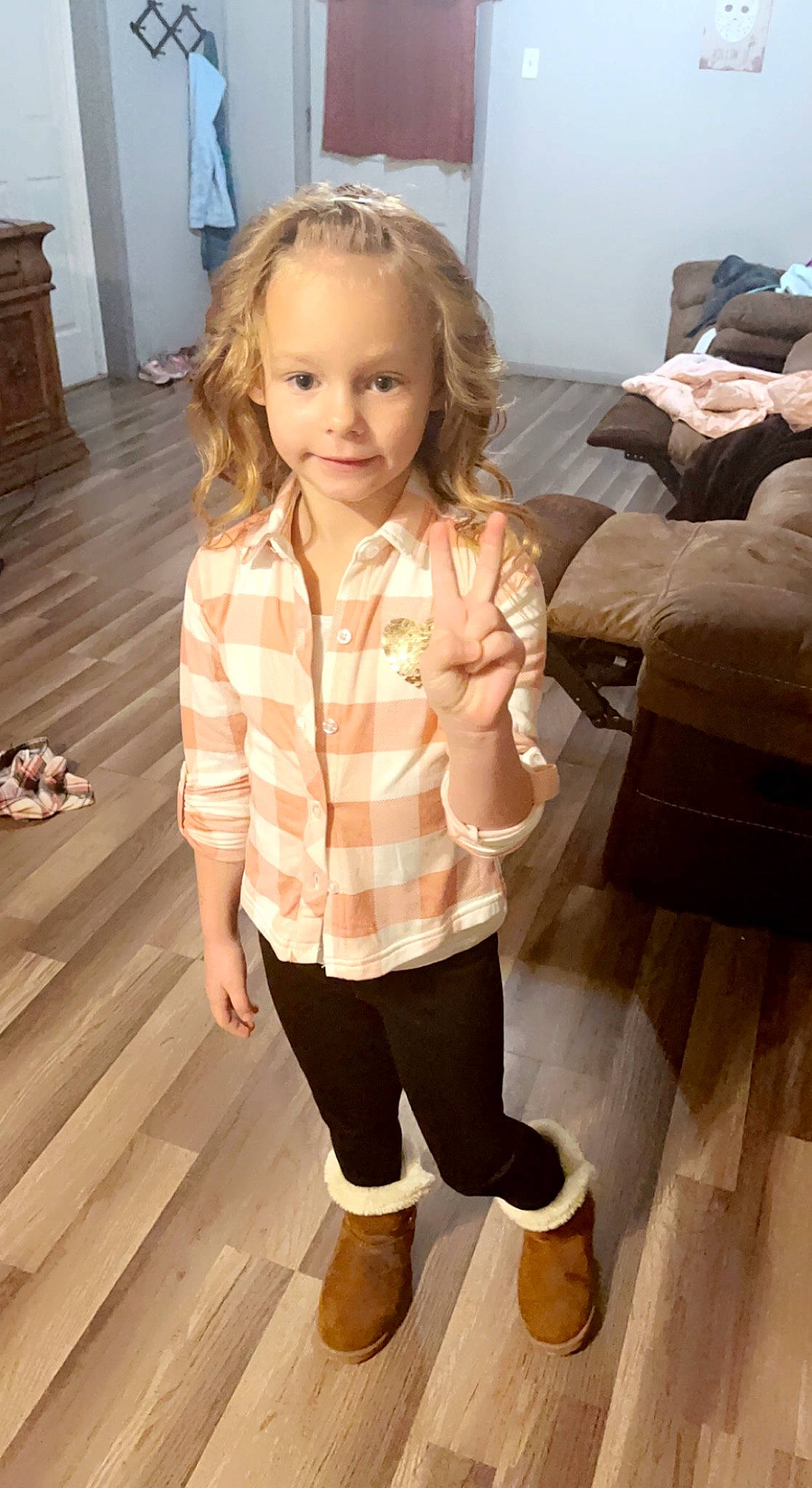 Addison is registered to the contest to win money with this photo: child, comfort, floor, flooring, hairstyle, hardwood, joint, joy, knee, person, shoe, shoulder, sleeve, smile, sneakers, sportswear, standing, thigh, toddler, waist