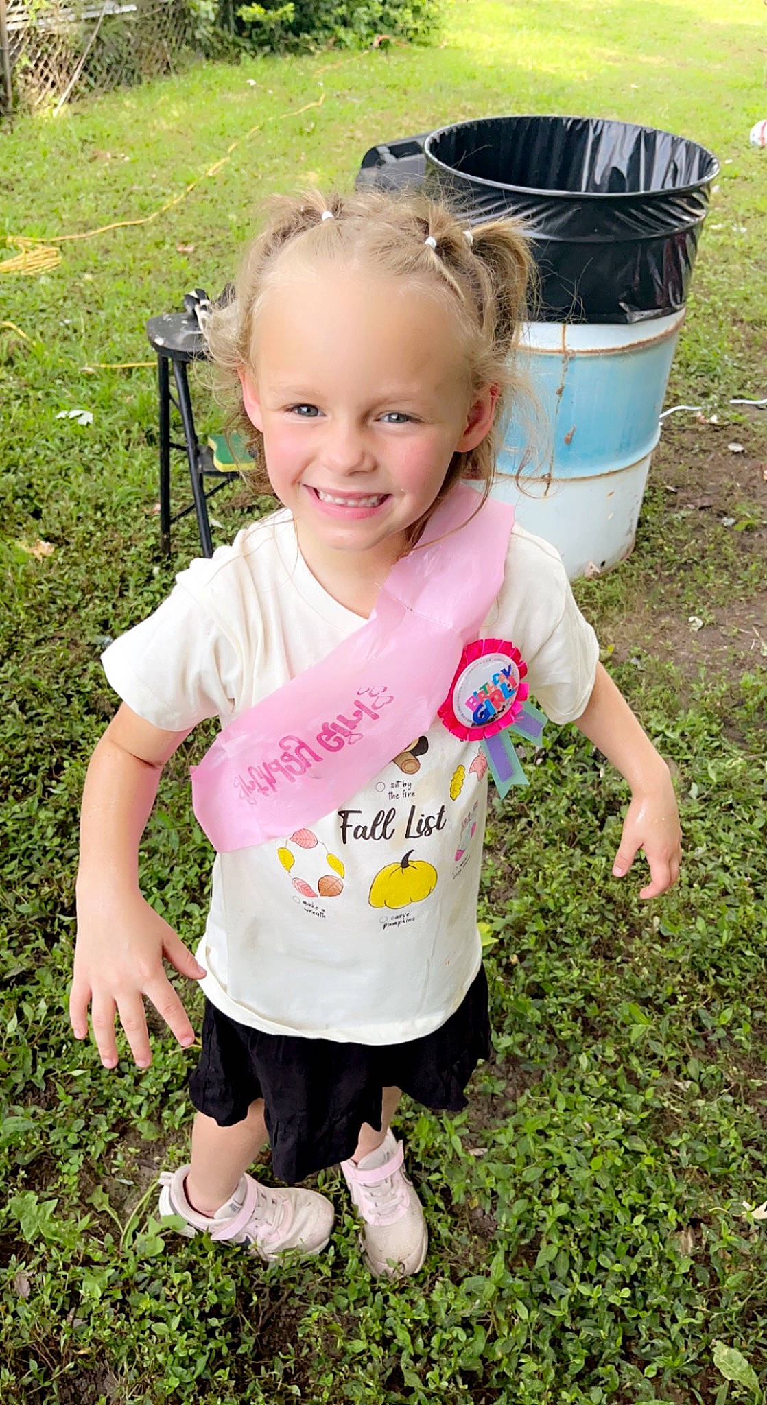 Addison is registered to the contest to win money with this photo: baby_toddler_clothing, facial_expression, fun, grass, grass_family, green, happy, joy, leaf, leisure, people, people_in_nature, person, photograph, pink, product, skin, sleeve, smile, summer