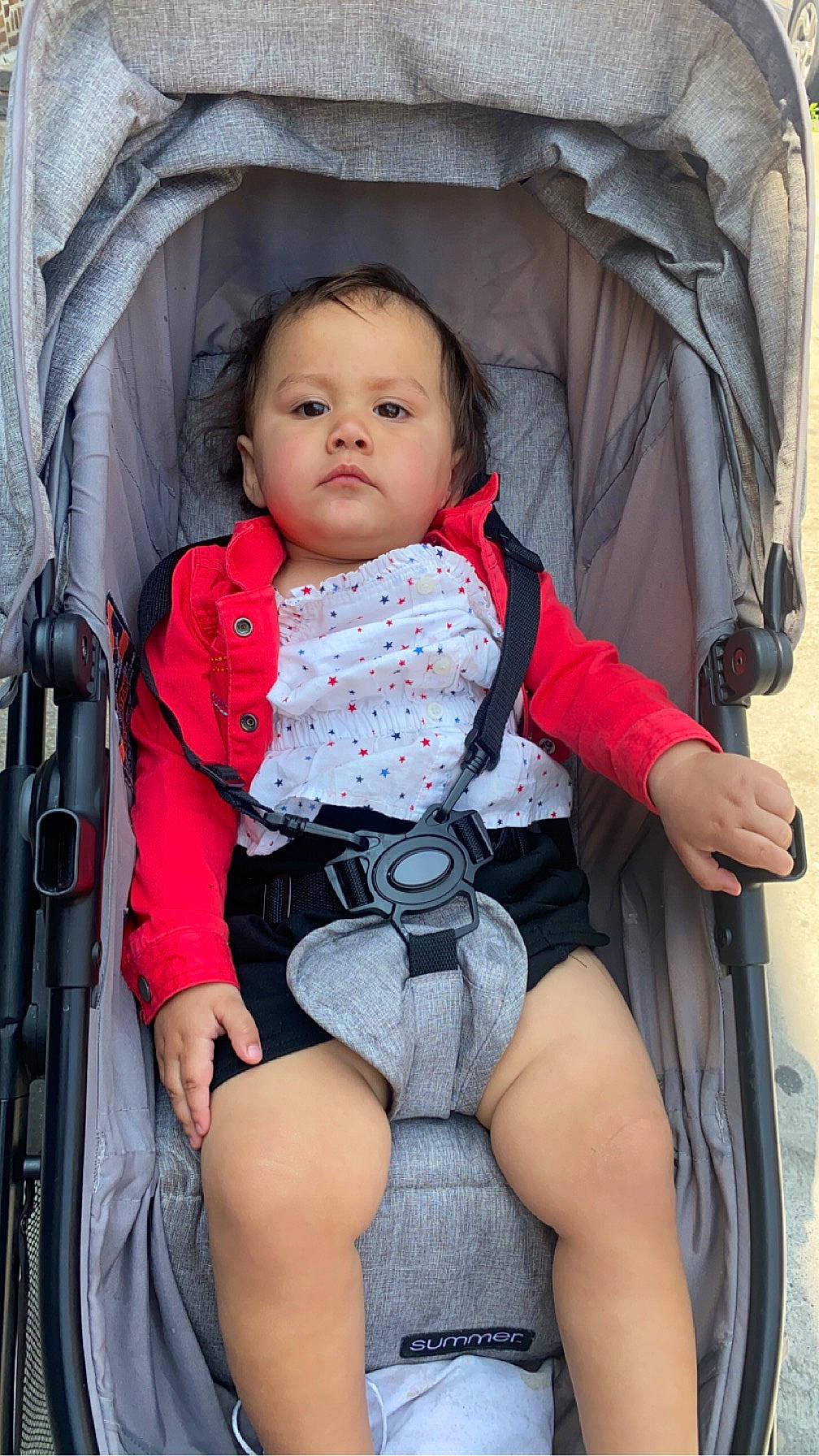Bea joined the competition — help win amazing prizes! baby, baby_carriage, baby_products, baby_toddler_clothing, chair, cheek, child, comfort, eye, head, lap, leg, person, pink, product, red, sitting, skin, thigh, toddler