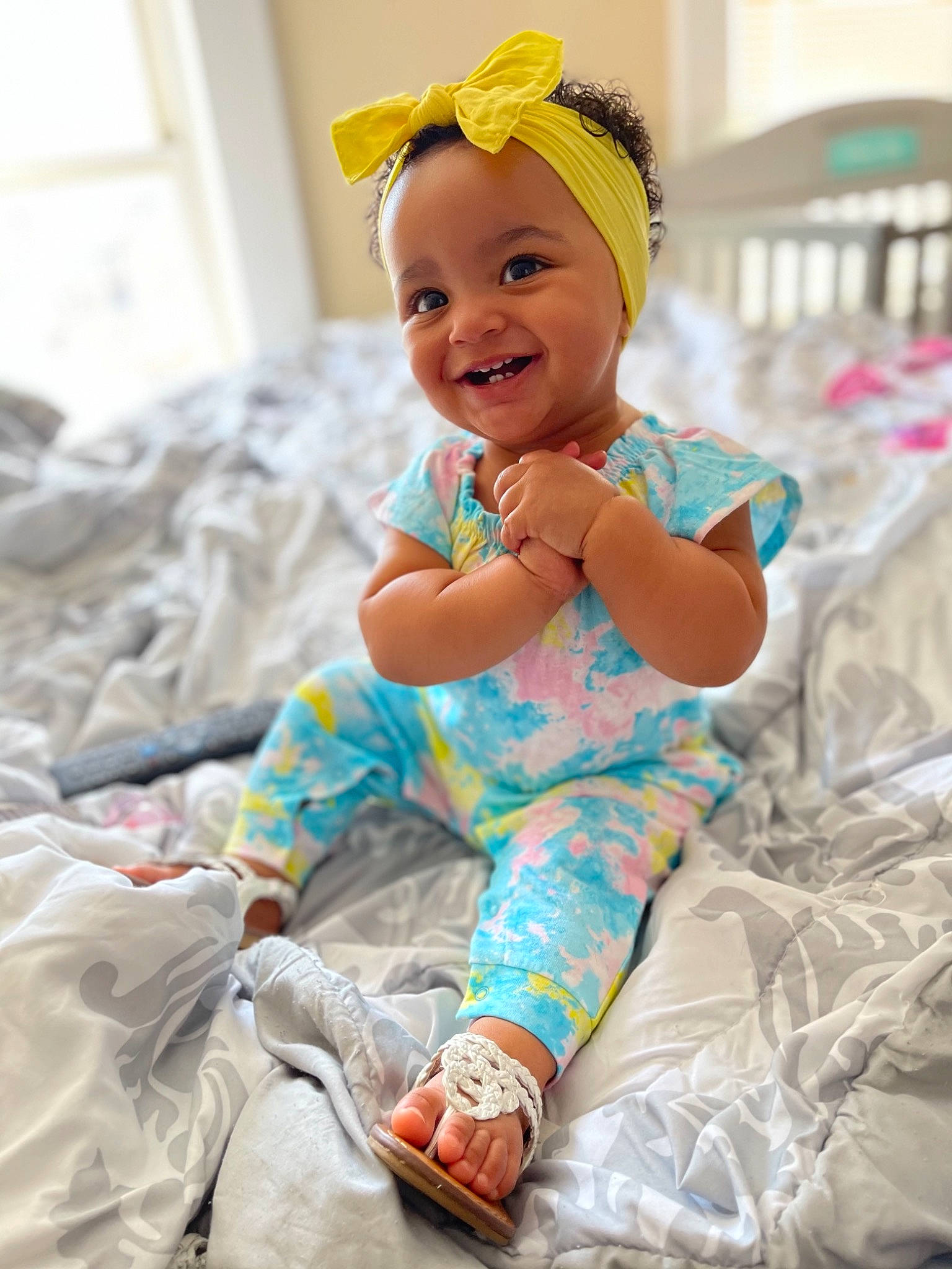 Penny is registered to the contest to win money with this photo: baby, baby_toddler_clothing, cap, child, comfort, dress, face, facial_expression, fun, happy, hat, headband, joy, magenta, person, pink, room, skin, sleeve, smile