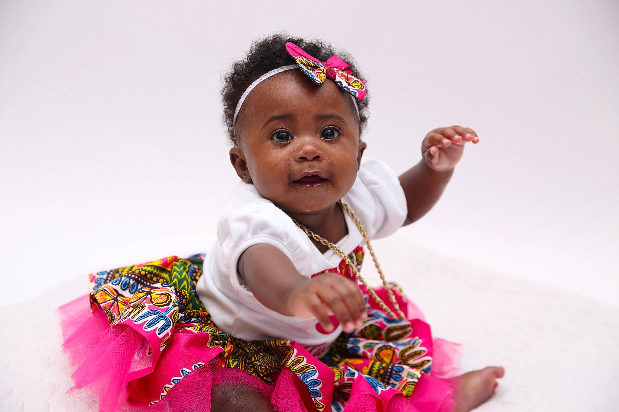 Justus joined the competition — help win amazing prizes! baby, baby_toddler_clothing, cheek, child, dress, event, eye, flash_photography, fun, gesture, happy, magenta, pattern, person, pink, portrait_photography, sitting, skin, sleeve, t_shirt