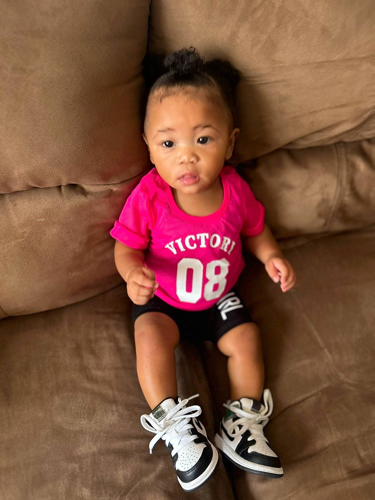 Jamia is registered to the contest to win money with this photo: arm, baby, baby_toddler_clothing, comfort, cool, eye, face, flash_photography, footwear, hand, happy, head, human_body, mammal, nose, person, pink, skin, sleeve, smile