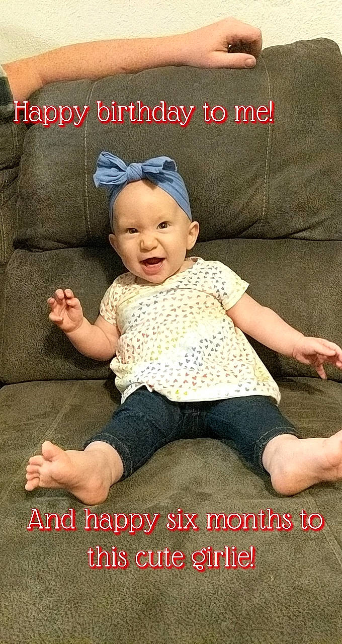 Emma-grace is registered to the contest to win money with this photo: baby, baby_toddler_clothing, child, comfort, couch, eye, face, font, grass, happy, hat, head, human_body, pattern, person, product, sitting, sleeve, smile, t_shirt