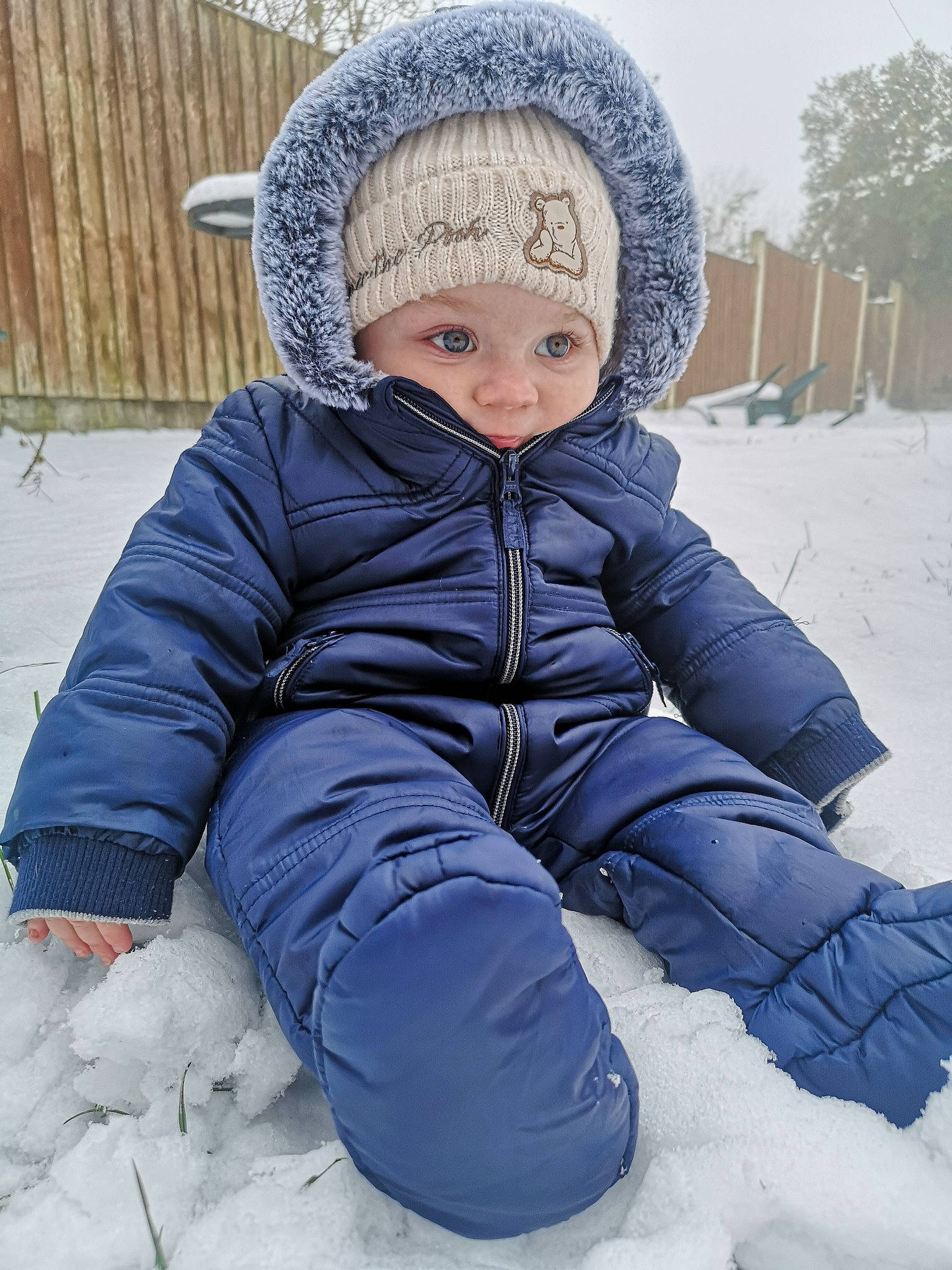 Elijah is registered to the contest to win money with this photo: baby, baby_toddler_clothing, cap, cheek, child, clothing, electric_blue, eye, freezing, fur, grass, headwear, jacket, knit_cap, outerwear, parka, person, sleeve, snow, toddler