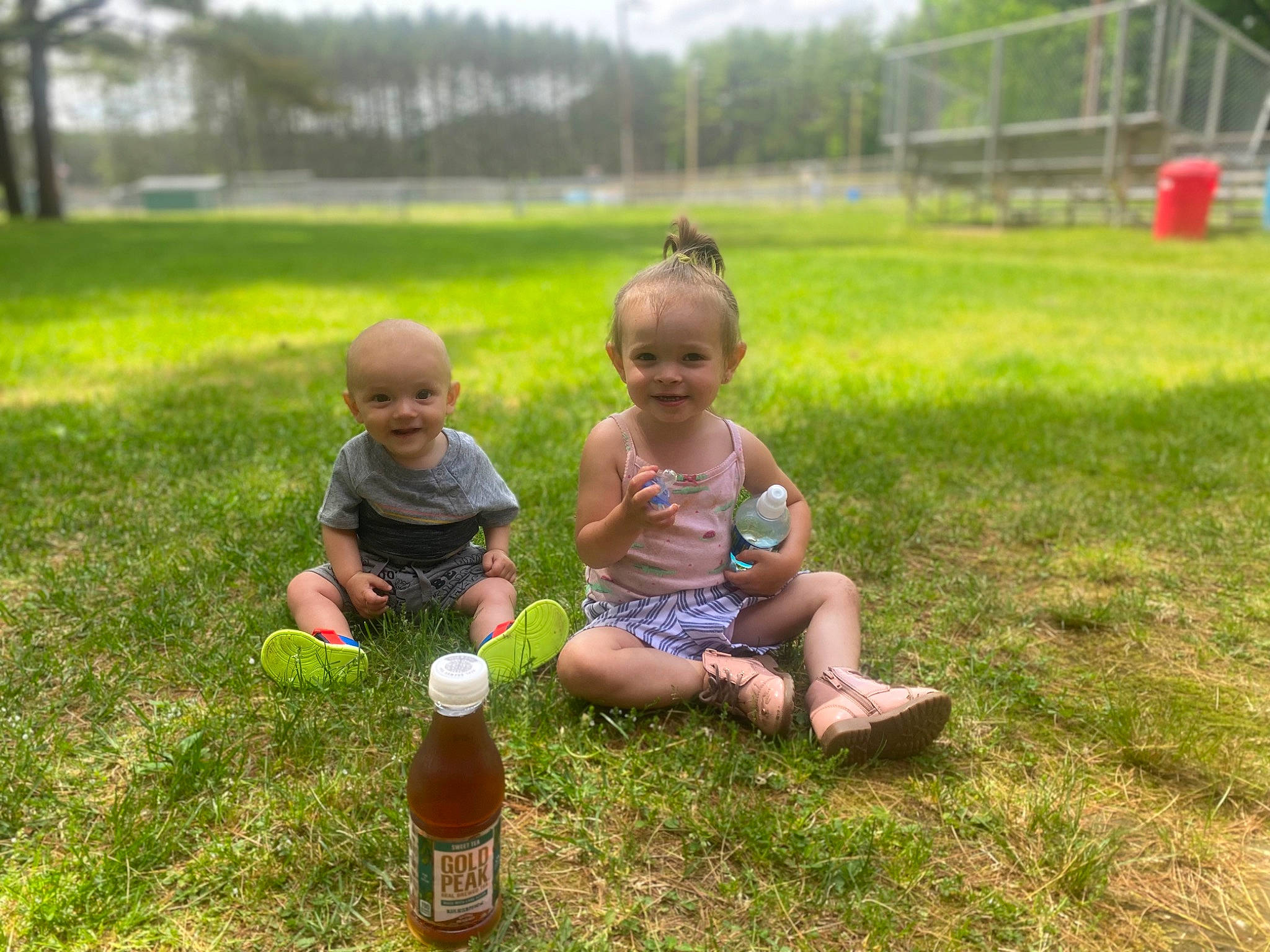 Adalynn joined the competition — help win amazing prizes! baby, bottle, child, fun, grass, grass_family, grassland, groundcover, happy, joy, lawn, leisure, meadow, people_in_nature, person, plant, recreation, shorts, smile, summer