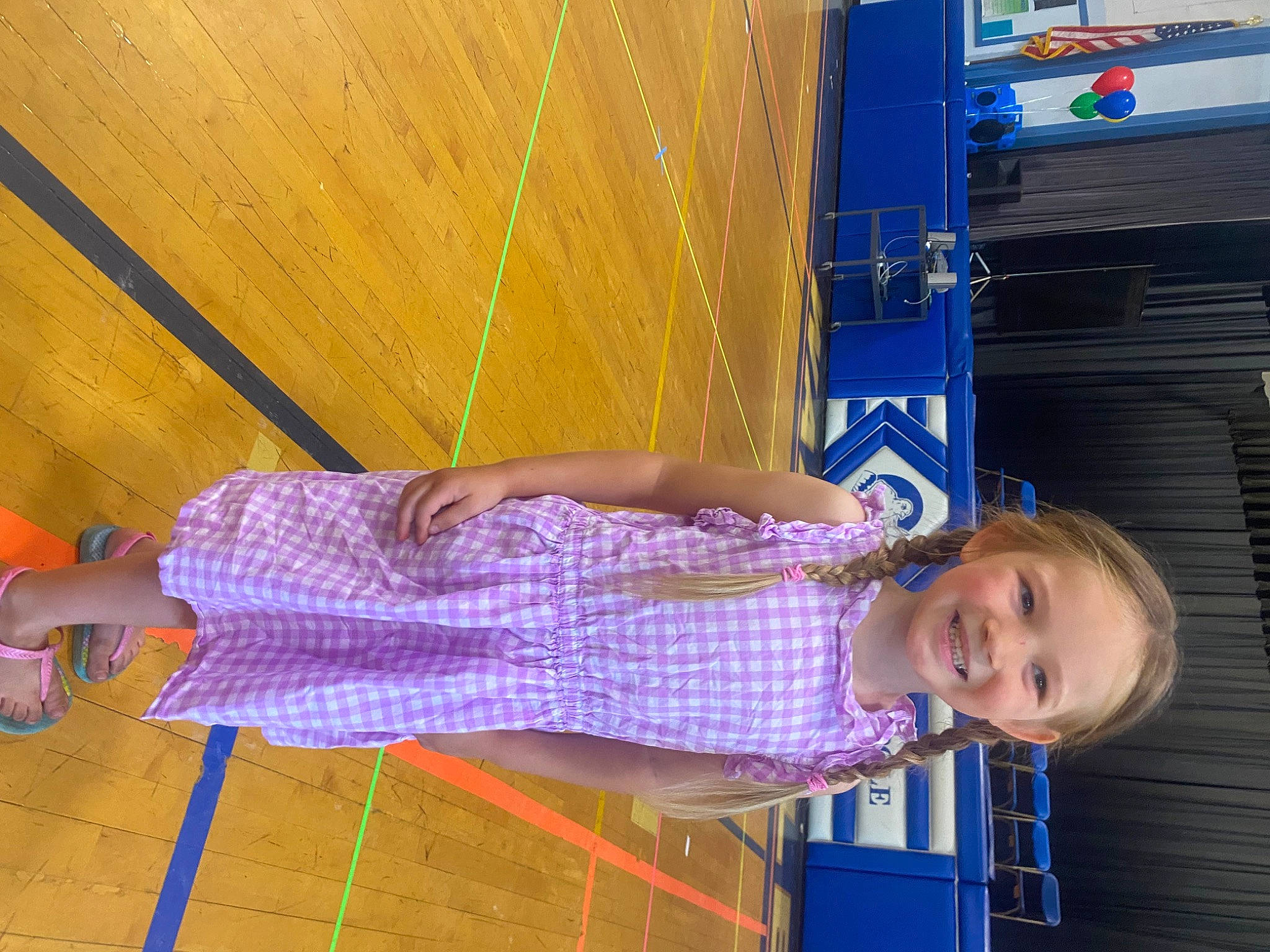 Scarlett is registered to the contest to win money with this photo: baby_toddler_clothing, blue, child, electric_blue, flooring, fun, hardwood, human_leg, joy, leisure, line, magenta, orange, pattern, person, purple, red, smile, toddler, travel