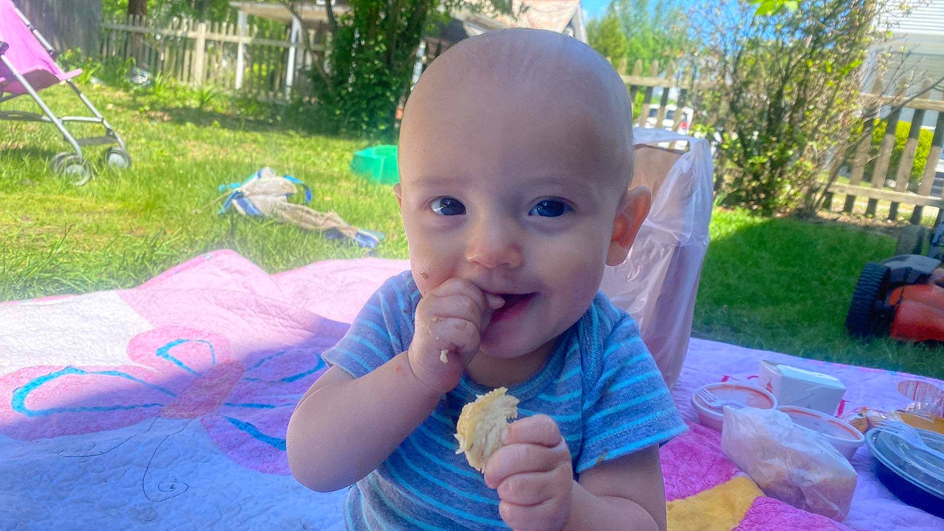 Brandyn joined the competition — help win amazing prizes! baby, baby_toddler_clothing, child, event, finger, fun, gesture, grass, happy, iris, leisure, person, pink, plant, recreation, smile, summer, tableware, thumb, toddler