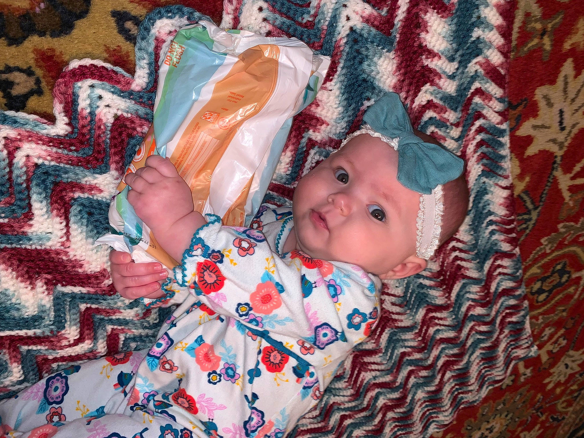 Sayge is registered to the contest to win money with this photo: baby, baby_products, baby_toddler_clothing, beauty, bedtime, carmine, child, event, happy, headwear, linens, pattern, people, person, pink, plaid, room, smile, textile, toddler